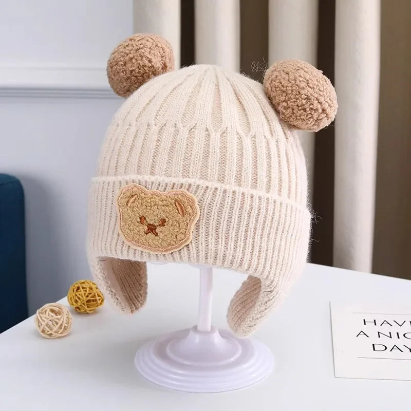 Gorro de lã para bebê, fofo, com proteção para as orelhas de urso, para crianças, inverno, grosso, tricotado, versão coreana do gorro infantil.