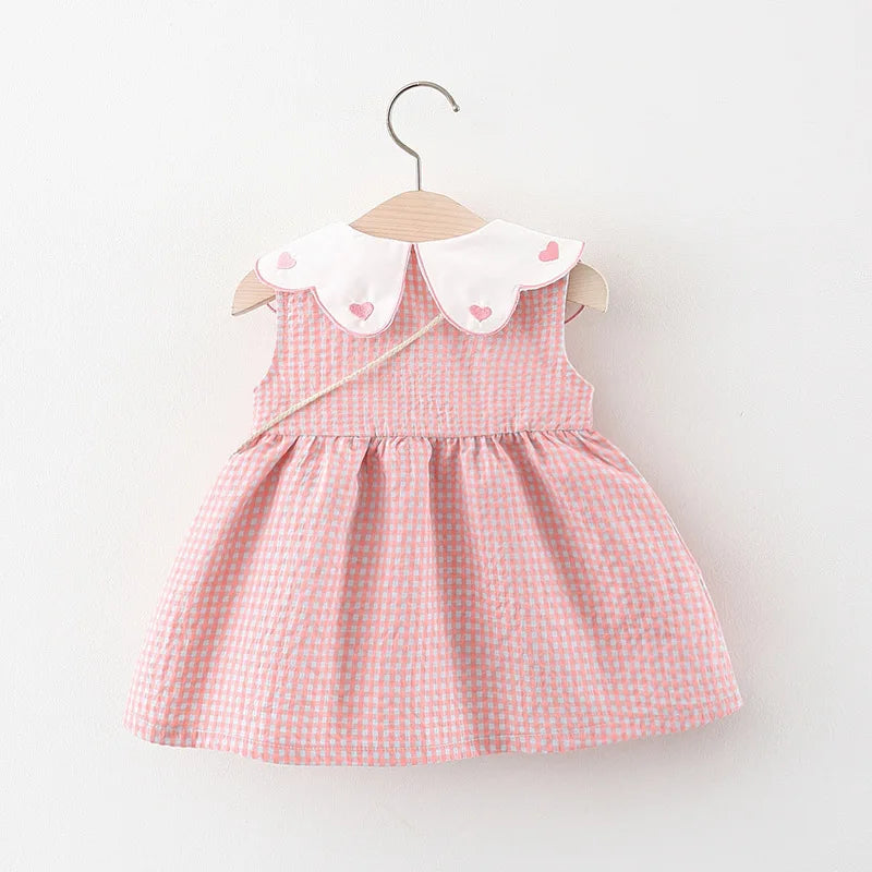 Vestido xadrez infantil acompanha bolsa