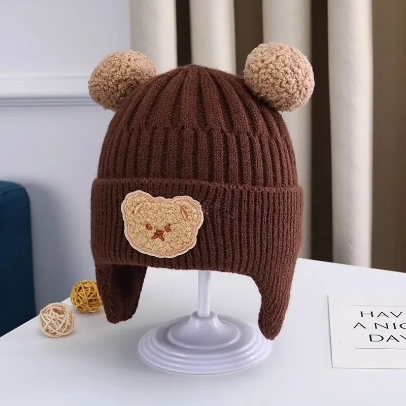 Gorro de lã para bebê, fofo, com proteção para as orelhas de urso, para crianças, inverno, grosso, tricotado, versão coreana do gorro infantil.