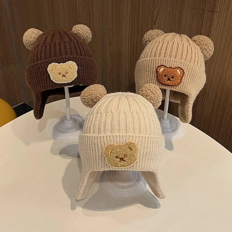 Gorro de lã para bebê, fofo, com proteção para as orelhas de urso, para crianças, inverno, grosso, tricotado, versão coreana do gorro infantil.