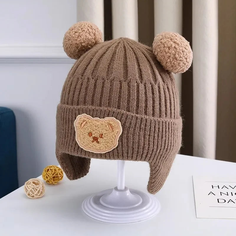 Gorro de lã para bebê, fofo, com proteção para as orelhas de urso, para crianças, inverno, grosso, tricotado, versão coreana do gorro infantil.