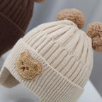 Gorro de lã para bebê, fofo, com proteção para as orelhas de urso, para crianças, inverno, grosso, tricotado, versão coreana do gorro infantil.